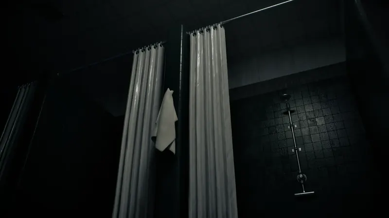 Shower stalls in a dark changing room